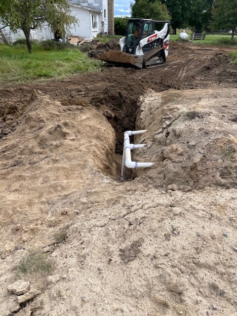 PVC distribution pipes installed for septic drain field